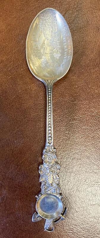 Souvenir Mining Spoon Golconda Mine Baker Co. OR.jpg - SOUVENIR MINING SPOON GOLCONDA MINE, BAKER CO., OR Sterling silver spoon, 5 3/8 in. long, engraved mining scene in bowl, bowl marked GOLCONDA MINE, BAKER CITY OR, handle front has floral decoration with dots down to the bowl and a miners gold pan with pick and shovel wrapped in sterling rope at top, reverse is marked Sterling and maker’s mark of Codding Bros. & Heilborn Co. (North Attleboro, MA. 1879-1918), excellent condition  [The Golconda Mine is a historic gold mine located in Baker County, Oregon, approximately 5 miles north of the town of Sumpter. The mine is located along Fruit Creek, in the Powder River watershed. The Golconda Mine’s major period of activity was 1897-1904. There are approximately 7,000 feet of underground workings including a 510 foot shaft. Today, two adits at the level of Fruit Creek have been observed and both are collapsed and discharging water. The Golconda Mine is currently owned by Armada Mining, Inc. of Vancouver, British Columbia, Canada.]